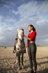 white horse and beautiful young woman. Fashion model with her white horse, Freedom, happiness, summer. Love
