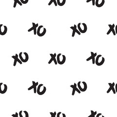 Seamless pattern with xoxo words. Brush stroke black and white repeat vector background.
