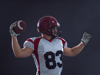 american football player throwing ball - Powered by Adobe