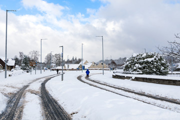 The cold snow front from Siberia strikes Scotland as people continue to go about their days.