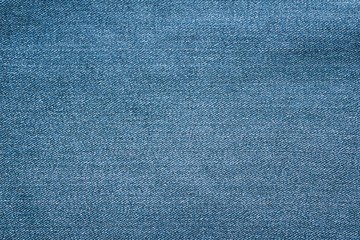 Texture of blue jeans textile close up