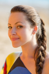 Portrait of attractive young woman looking at camera smiling