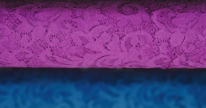 Macro shot of a lace, fabric used to make elegant wedding dresses for the wedding day. Concept of: tailoring, colors, bride and marriage
