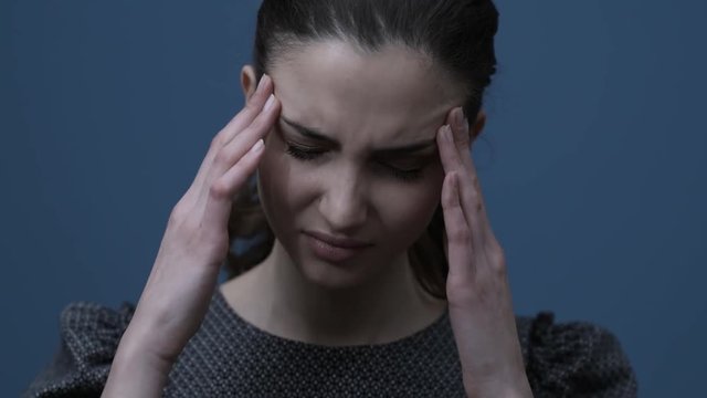 Young woman having an headache