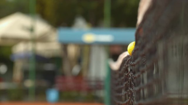 Ball hitting the tennis net
