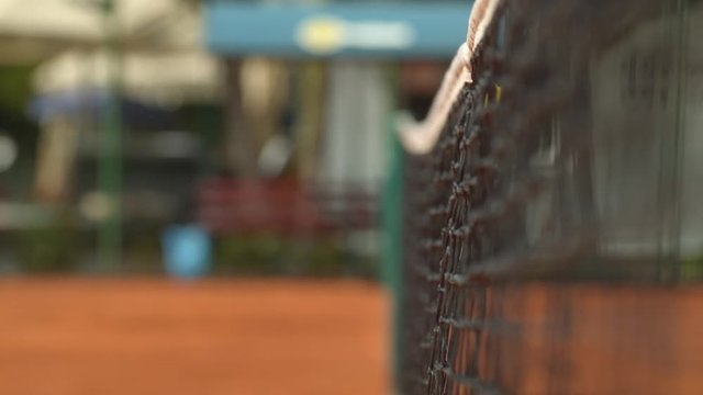 Ball hitting the tennis net
