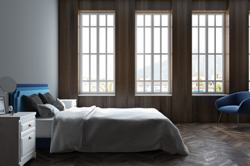 Dark wooden bedroom, three windows
