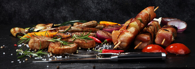 Assorted delicious grilled meat with vegetable on a barbecue