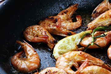 Grilled shrimp skewers. Seafood, shelfish. Shrimps Prawns skewers with herbs, garlic and lemon.