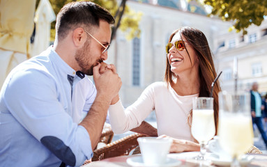 Romantic couple at the meeting in a cafe. Dating, love, relationships