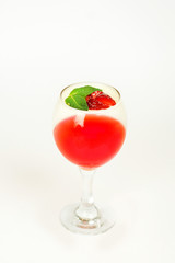 dessert jelly in a glass with strawberries on a white background