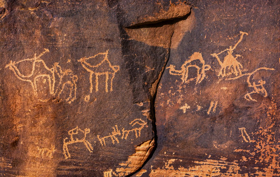 Ancient Camel Petroglyphs, Wadi Rum, Valley of the Moon, Jordan. Inhabited by humans since prehistoric times. Petroglyphs were used to guide caravans.