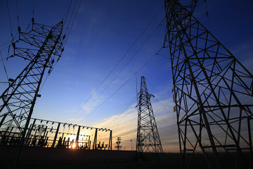 A high voltage substation in the sky at sunrise