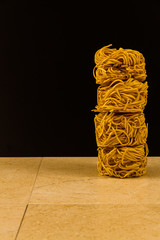 Stack of noodle nests, with copyspace.