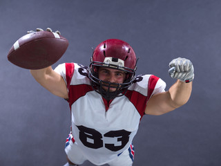 american football player celebrating touchdown