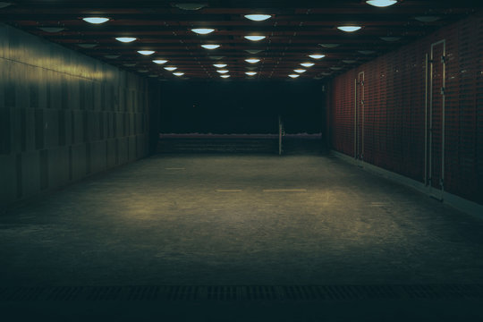 Central marketplace at night time. Isolated territory filled with trading stands and lighten by city lights. Spooky and abandoned atmosphere in urban market territory. 