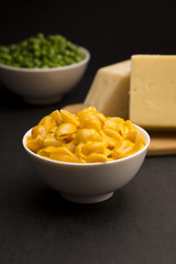 Macaroni Shells and Cheese on a Dark Slate Background