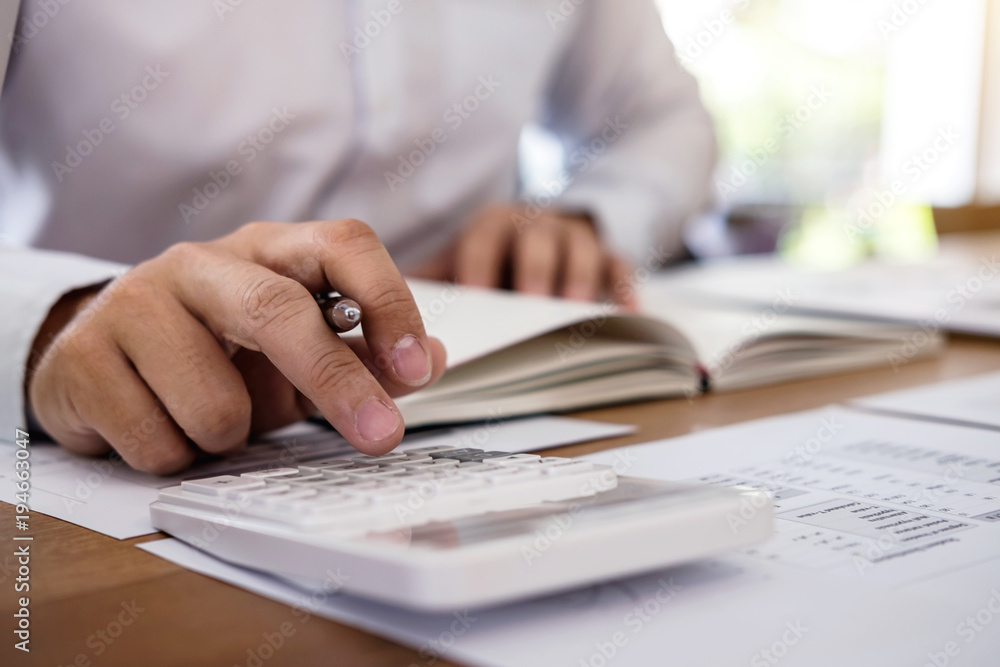 Poster professional businessman working with calculator, doing finance on laptop, document graph and analys