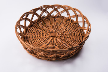 empty cane basket or tokri in hindi and topli in marathi, isolated over white background
