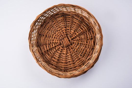 empty cane basket or tokri in hindi and topli in marathi, isolated over white background
