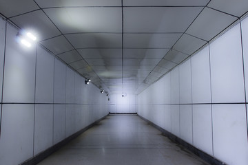 Underpass in the city under the road at night