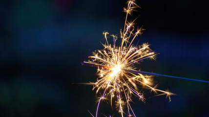 beautiful macro closeup of a sparkler at night