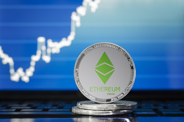 ETHEREUM classic (ETC) cryptocurrency; silver ethereum classic coin on the background of the chart