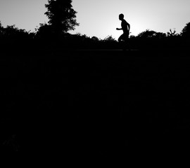 Close up the runner start from run on railroad tracks with dramatic tone, Sunset running in the evening