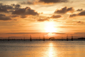 The sun fell into the water at the lake in the evening   