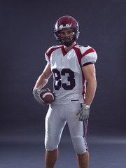 Fototapeta premium American Football Player isolated on gray