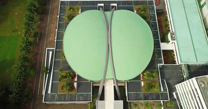 JAKARTA - Indonesia. February 28, 2018: Bird view of DPR/MPR Building from a drone flying backward in Jakarta. Shot in 4k resolution