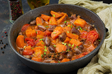 Chicken hearts with pumpkin and tomatoes in tomato sauce.