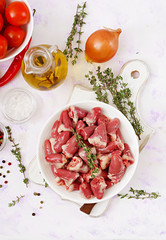 Ingredients for cooking chicken hearts with pumpkin and tomatoes in tomato sauce. The garnish is served with boiled rice. Flat lay. Top view.