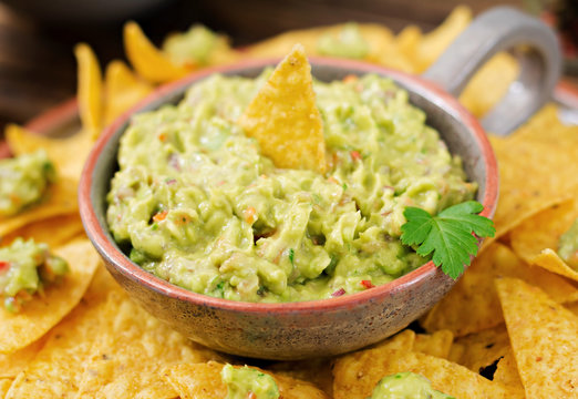 Guacamole avocado, lime, tomato, onion and cilantro, served with nachos - Traditional Mexican snack