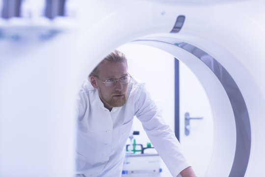Radiologist with MRI machine