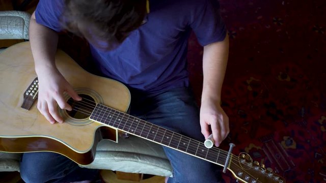 Looking straight down on a beater slide guitar with pvc sider.