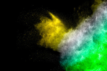 Color Holi powder splattered in Indian festival. Color powder explosion. Flag of India made with colorful powder splash isolated on black background.