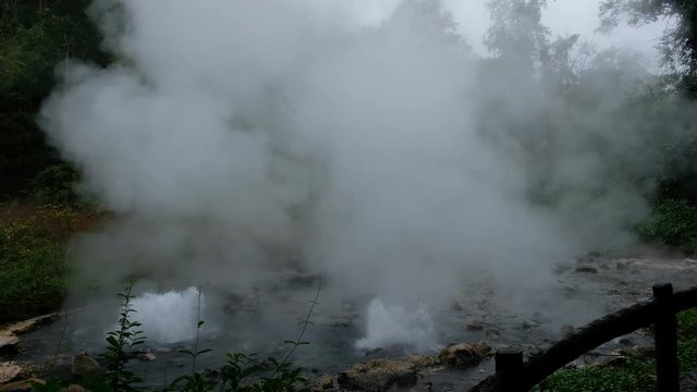 Hot springs (Geyser type) with rocks and green jungle.Pongduet Pa Pae Hotspring, Chiang Mai Province,Thailand 
