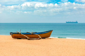 Yellow fishing boat on the shores of the Indian ocean. Goa. India. Vacation holidays travel background wallpaper