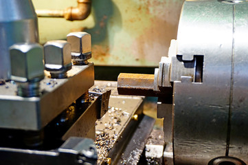 The hexagon in the lathe chuck is machined with a chisel on a chipper.  