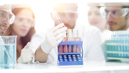 closeup of a group of scientists and pharmacists in the laborato
