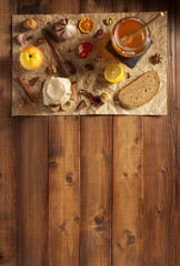 glass jar of honey on wood