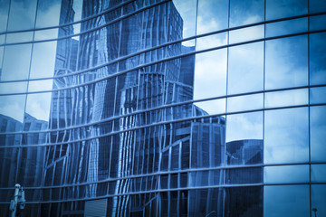 Glass walls of urban skyscrapers