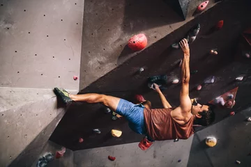 Foto op Aluminium Man climbing indoor boulder wall © Jacob Lund