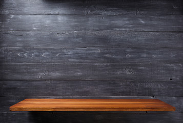 shelf at wooden background wall