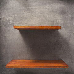 wooden shelf at concrete wall