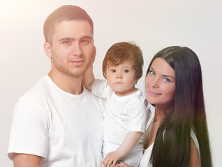 Happy family with newborn baby on a white background.