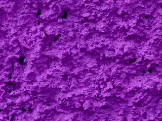 Concrete violet plastered wall. Violet plastered wall texture grunge as pattern background. Beautiful decorative violet plastered wall or painted stucco. Handmade rough winter violet christmas paper