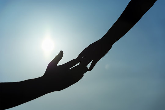 silhouette of helping hand concept and international day of peace. Support. international day of peace.friendship.help me