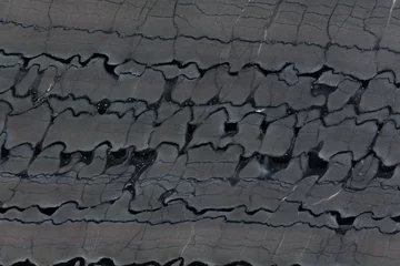 Fotobehang Close up of gray and black. quartzite stone texture. © Dmytro Synelnychenko